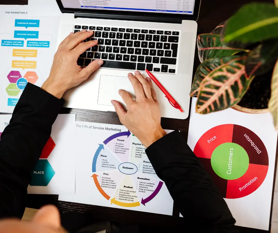 A man using his laptop to list products online with the Best CrazyVendor Tools to Boost Online Sales.